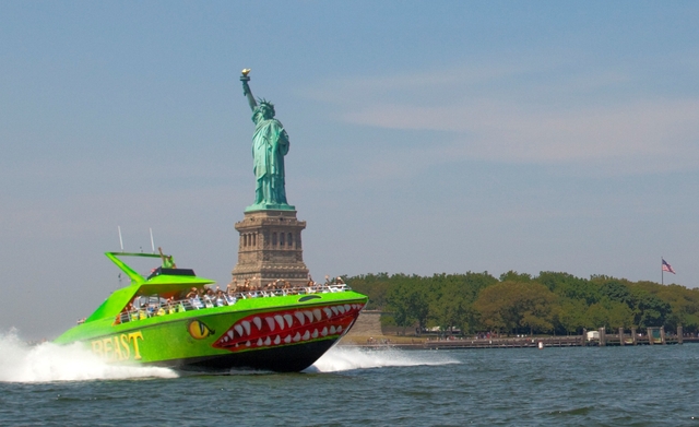 The Beast powerboat passes the Statue of Liberty