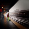 A worker keeps the train platform clean